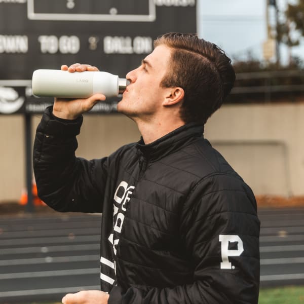 Photo of man drinking LARQ Bottle PureVis™ - Granite White