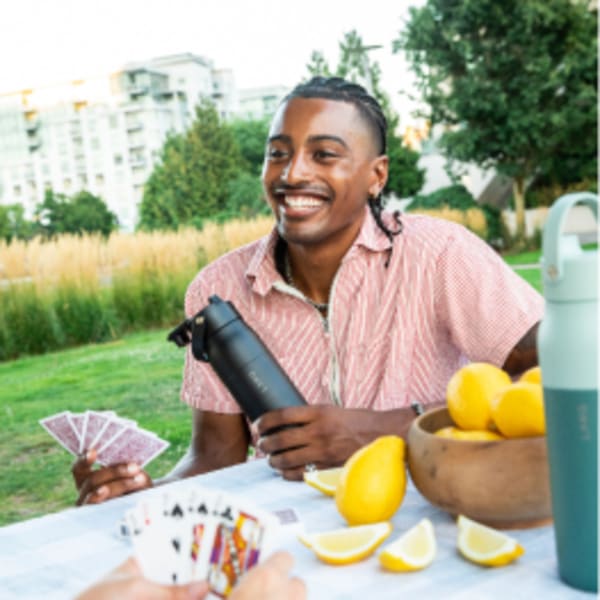 Photo of LARQ Bottle Swig Top - Obsidian Black on table with lemons